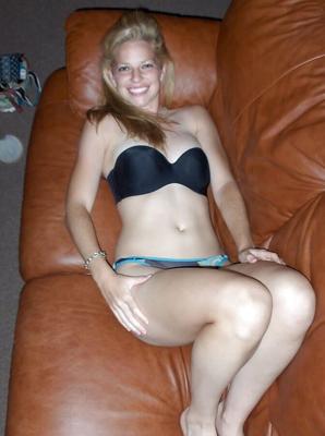 Blonde Posing On Leather Couch