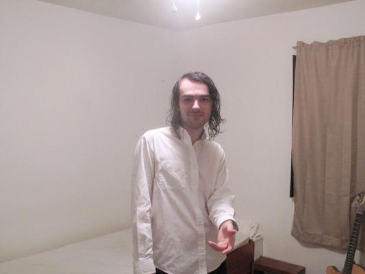 Long haired guitarist Nick Narsis invites you to his bedroom