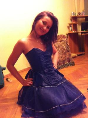 Russian teen girl showing off in her new party dress