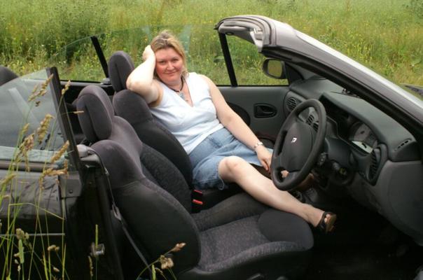 Davina Sky posing in the car