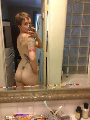 Short haired tattooed hipster emo girl. Selfies, dressed and art