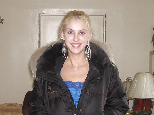 Blonde teen with earrings tends to spread