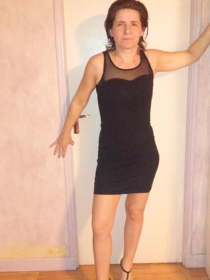 amateur brunette in little black dress stripping and spreading