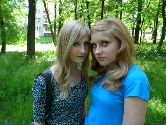 two girls having fun in forest