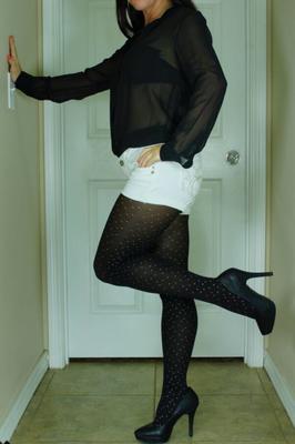 Lauren removing her white-dotted black pantyhose and heels