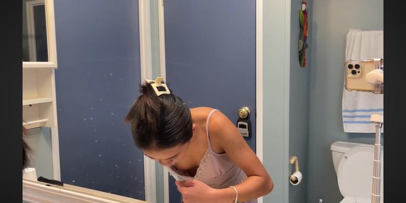 YouTuber brushing her teeth downblouse