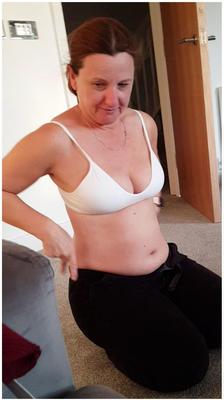 Shy, mature, chubby milf showing her bra. Want to see her boobs?